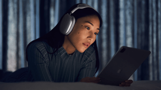 Woman wearing AirPods Max headphones