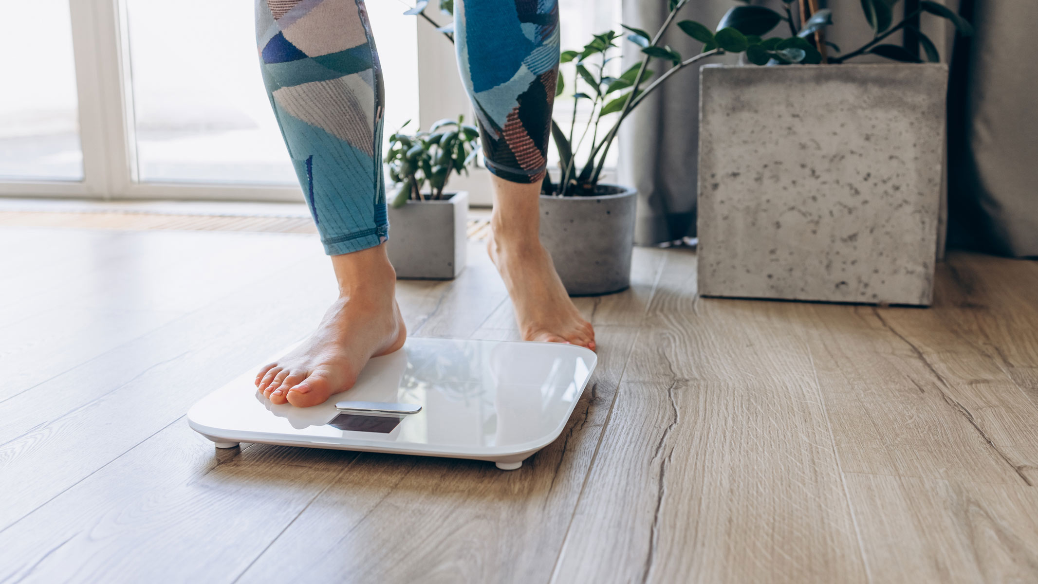A woman standing on a smart scale