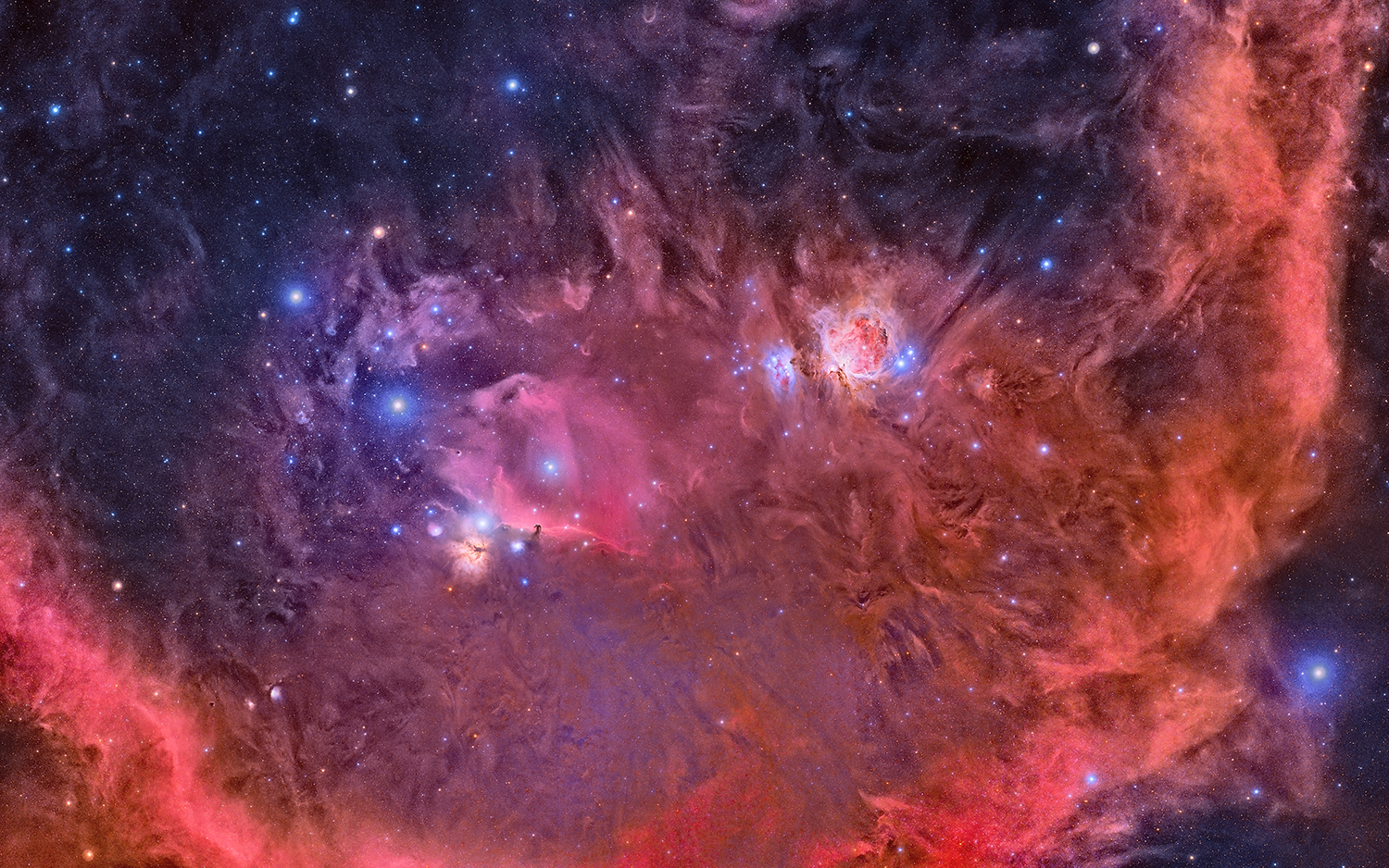 In this image, a mosaic of nine photographs, the Orion Nebula and the Horsehead Nebula are ringed by the emission nebula known as Barnard&rsquo;s Loop.