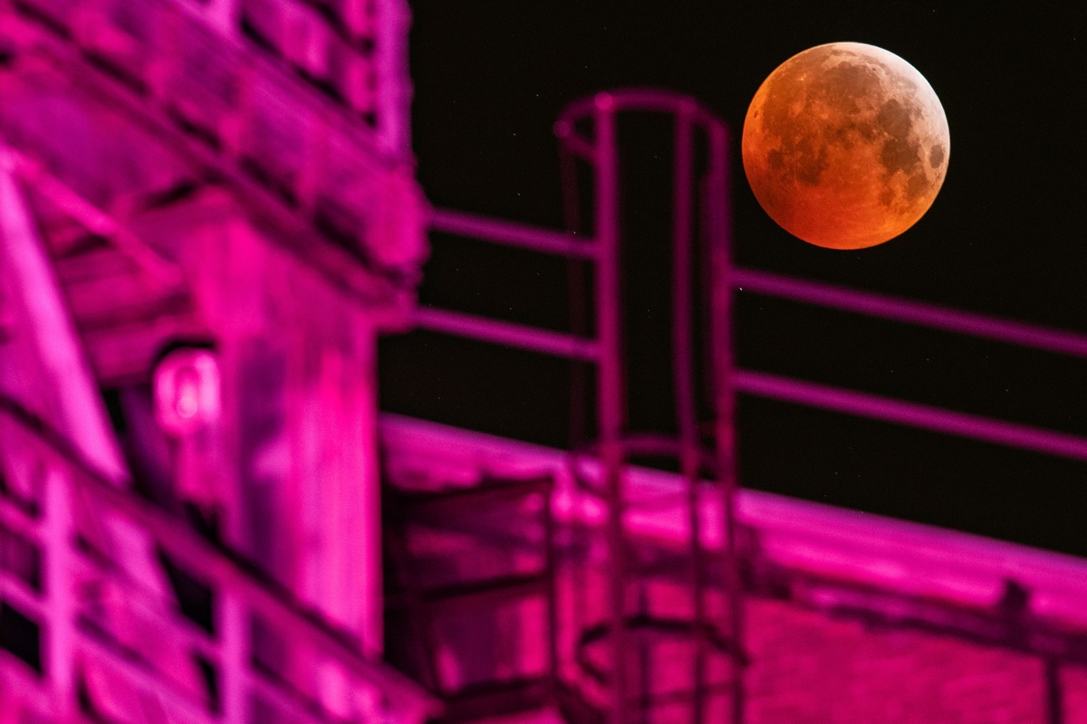 Marcel Kusch captures this image in Duisburg, Germany, showing the super blood moon eclipse above an industrial plant.