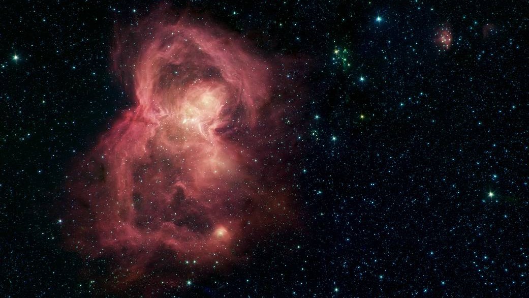 Butterfly Nebula glows red in spectacular image from NASA's Spitzer