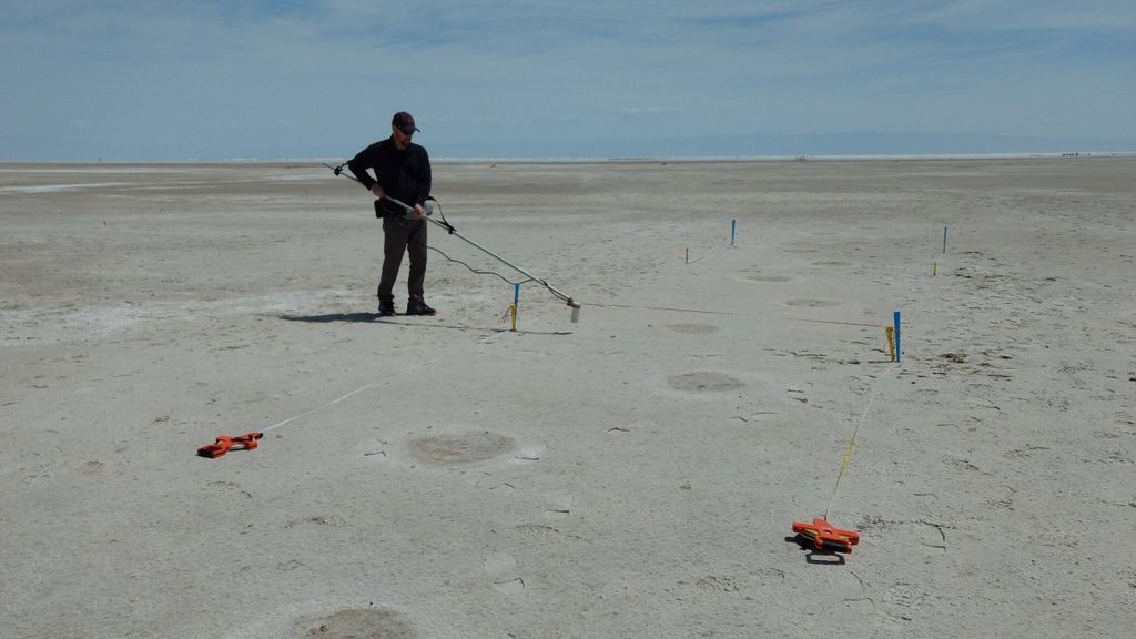 The round impressions on the ground in this photograph show mammoth footprints. The mammoth crossed the human’s path after the human passed on his or her northbound journey. Hours later, the human stepped in the mammoth footprints on the southbound trip back.