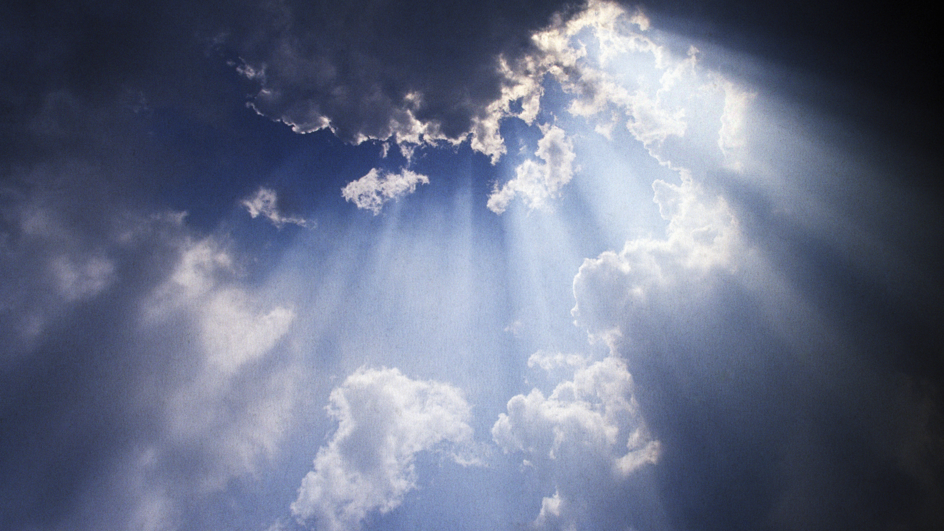 Sun rays breaking through clouds