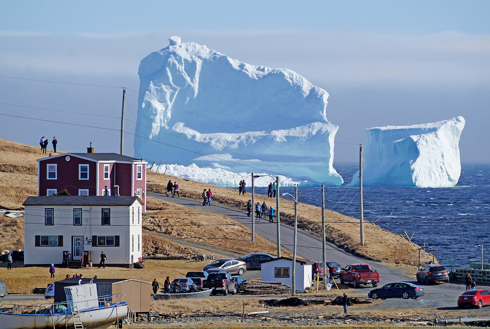 A giant iceberg drifts by "Iceberg Alley" near Ferryland in Newfoundland, Canada.