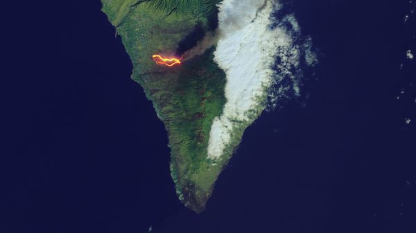 Bright streaks of lava flow through populated parts of the Spanish island of La Palma on Sept. 26, 2021.
