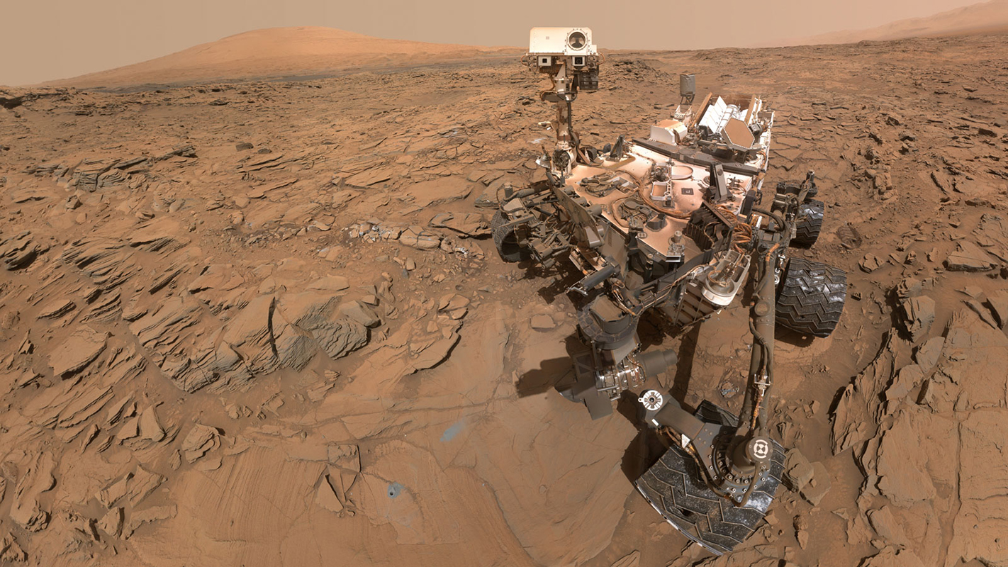 This May 11, 2016, self-portrait of NASA&rsquo;s Curiosity Mars rover shows the vehicle at the &ldquo;Okoruso&rdquo; drilling site on lower Mount Sharp&rsquo;s &ldquo;Naukluft Plateau.&rdquo; Scientists want to send Curiosity higher on Mount Sharp, to look for evidence of liquid water.