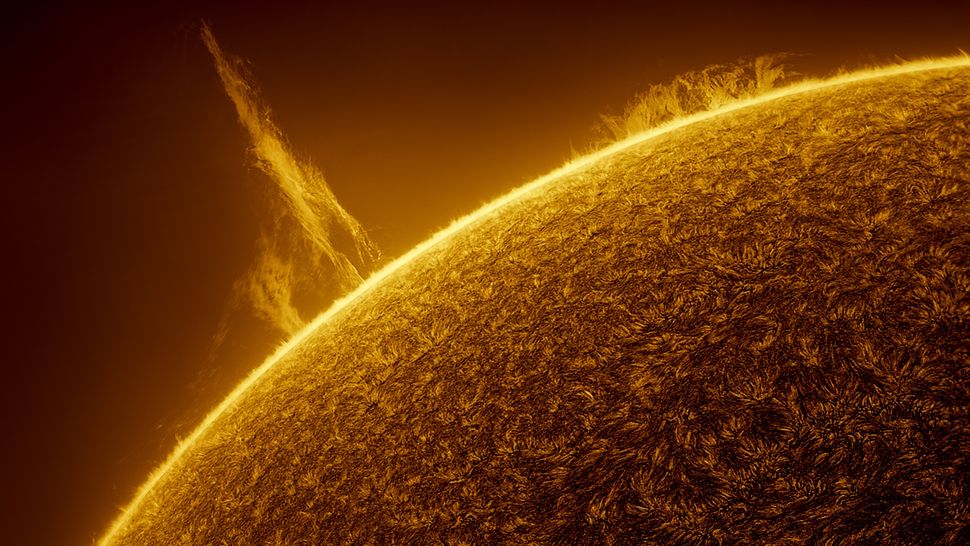 Stunning solar tornado swings into space above the glowing sun (video