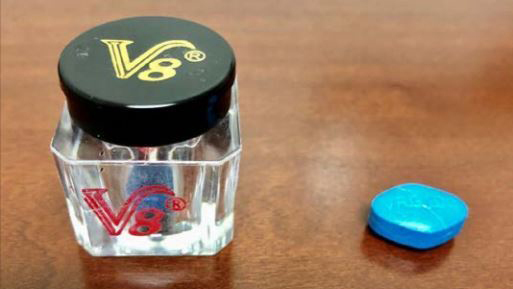 A jar of "V8" male enhancement supplements, which contain blue tablets that closely resemble prescription Viagra.