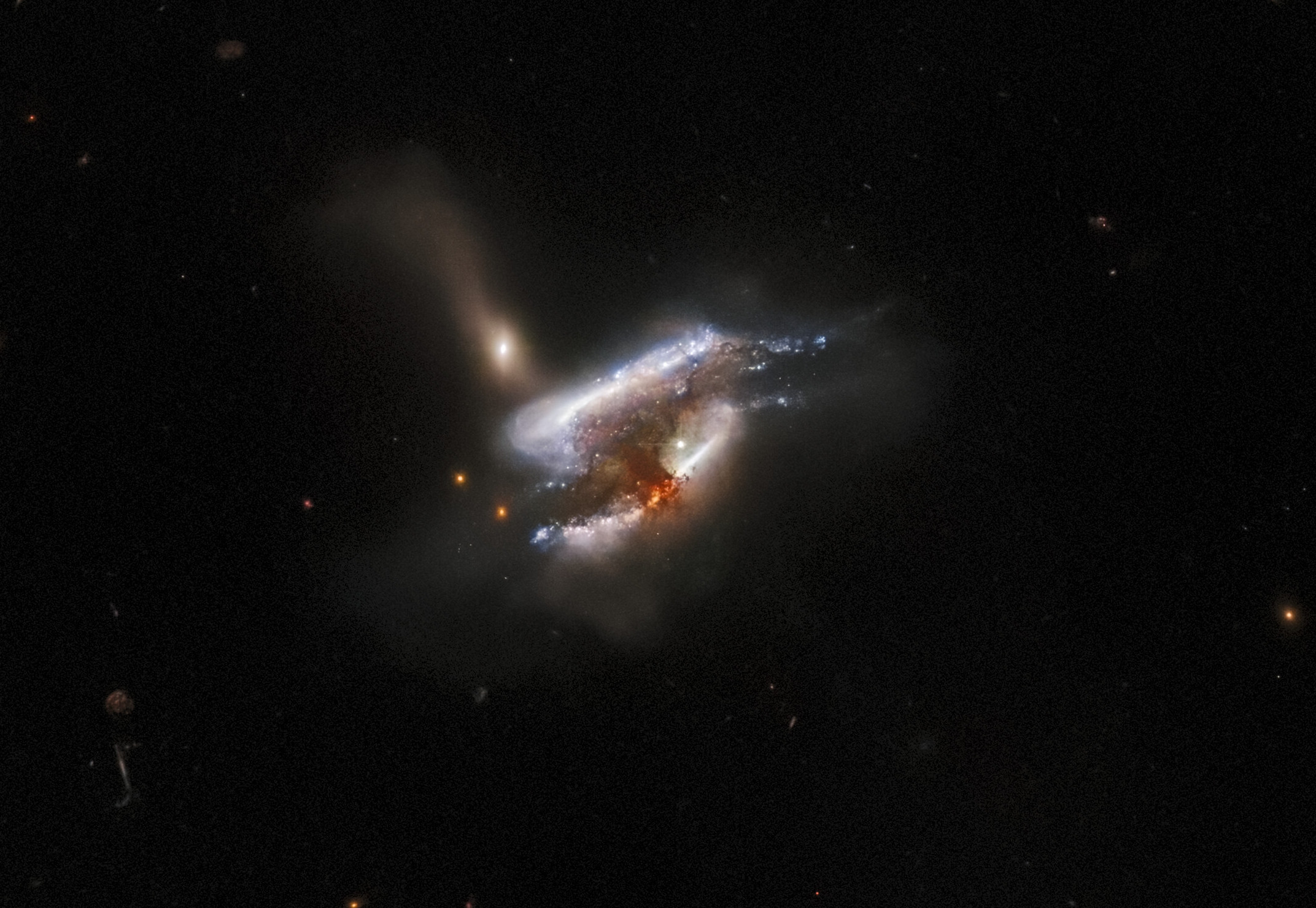 Three galaxies are tearing each other apart in stunning new Hubble