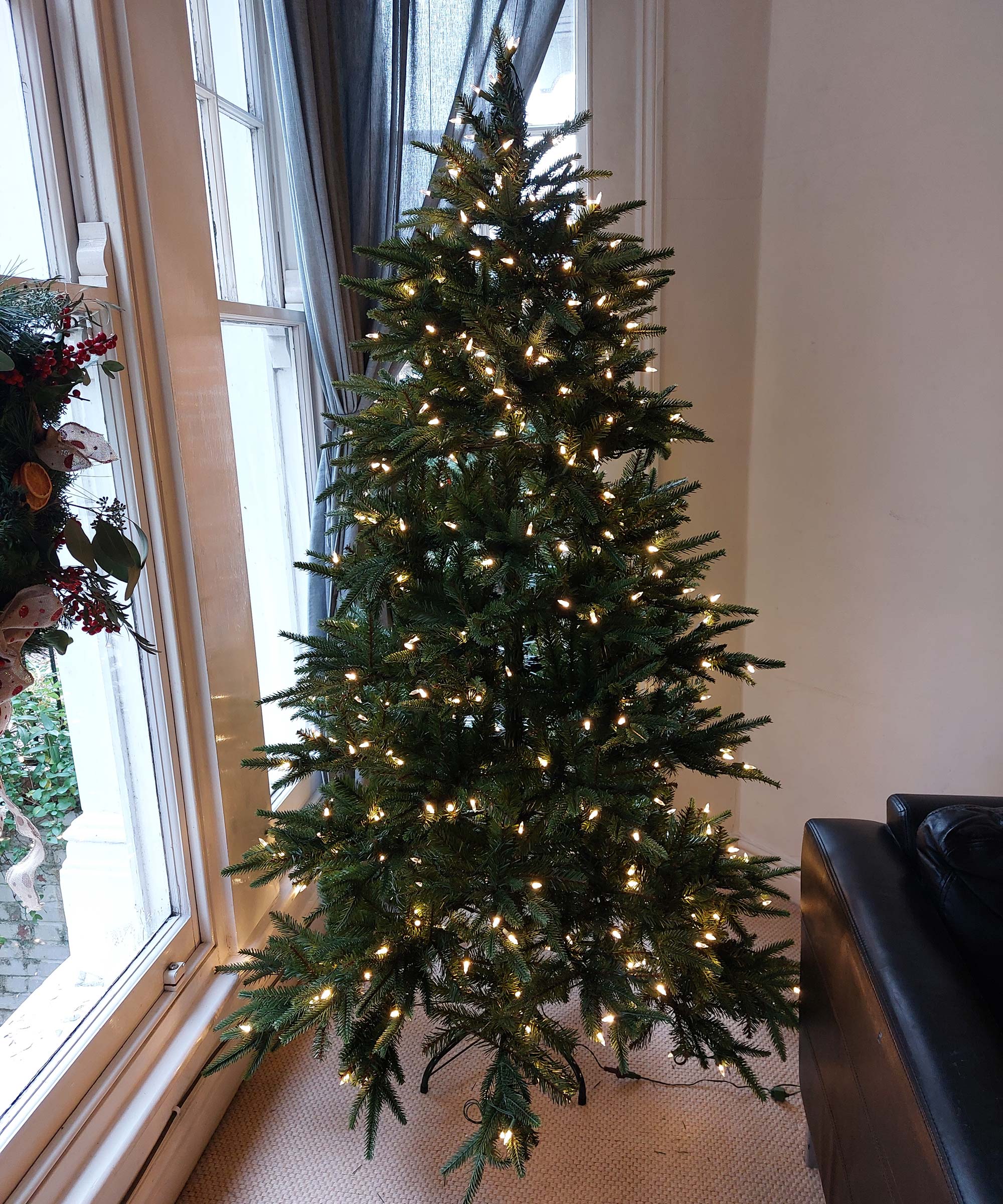 We tried the make artificial Christmas tree look fuller hack Real Homes