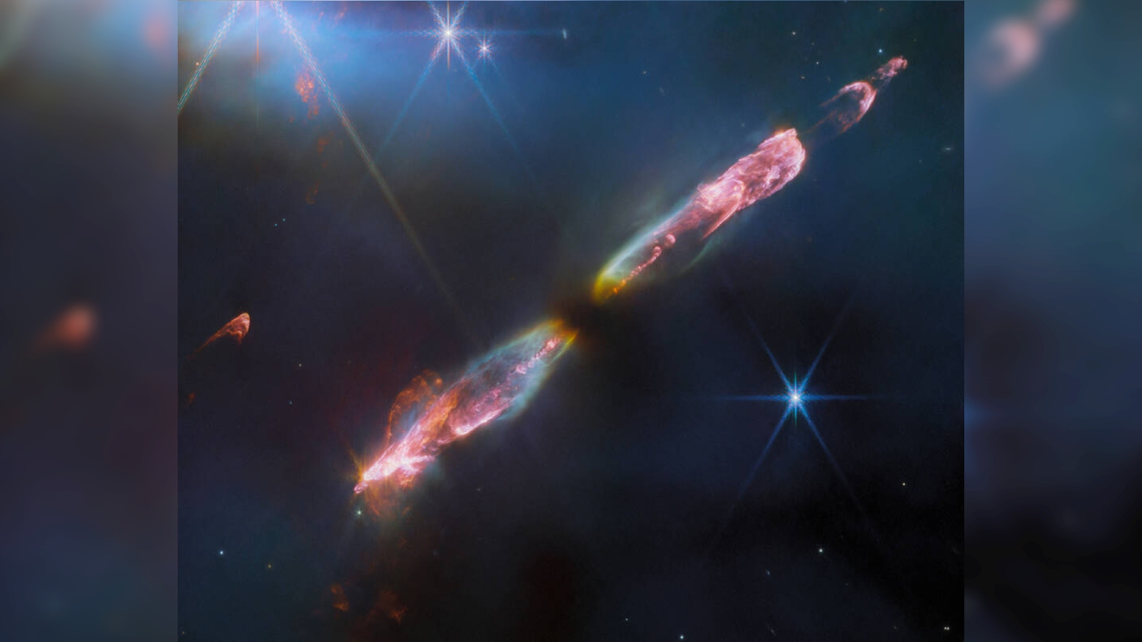 Two jets of luminous gas and dust shooting out of a baby star