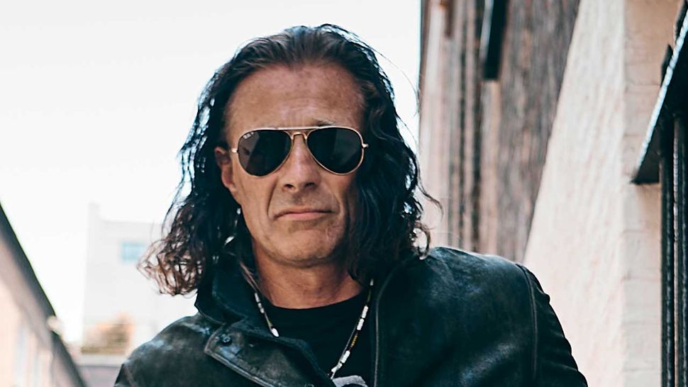 By day he's the manager of football's Queens Park Rangers, by night he