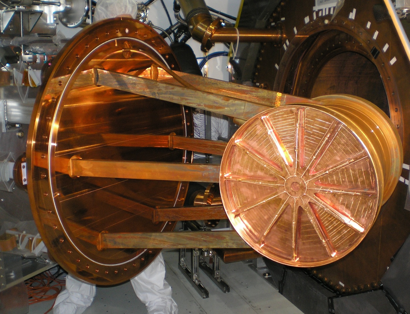 This large copper cylindrical vessel is the Enriched Xenon Observatory 200�s (EXO-200) time projection chamber, the part of the detector that contains the liquid xenon, isotopically enriched in xenon-136. The photo shows the chamber being inserted into th