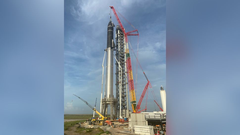 SpaceX&rsquo;s first orbital Starship SN20 is stacked atop its massive Super Heavy Booster 4 for the first time on Aug. 6, 2021 at the company&rsquo;s Starbase facility near Boca Chica Village in South Texas. They stood 395 feet tall, taller than NASA&rsquo;s Saturn V moon rocket.