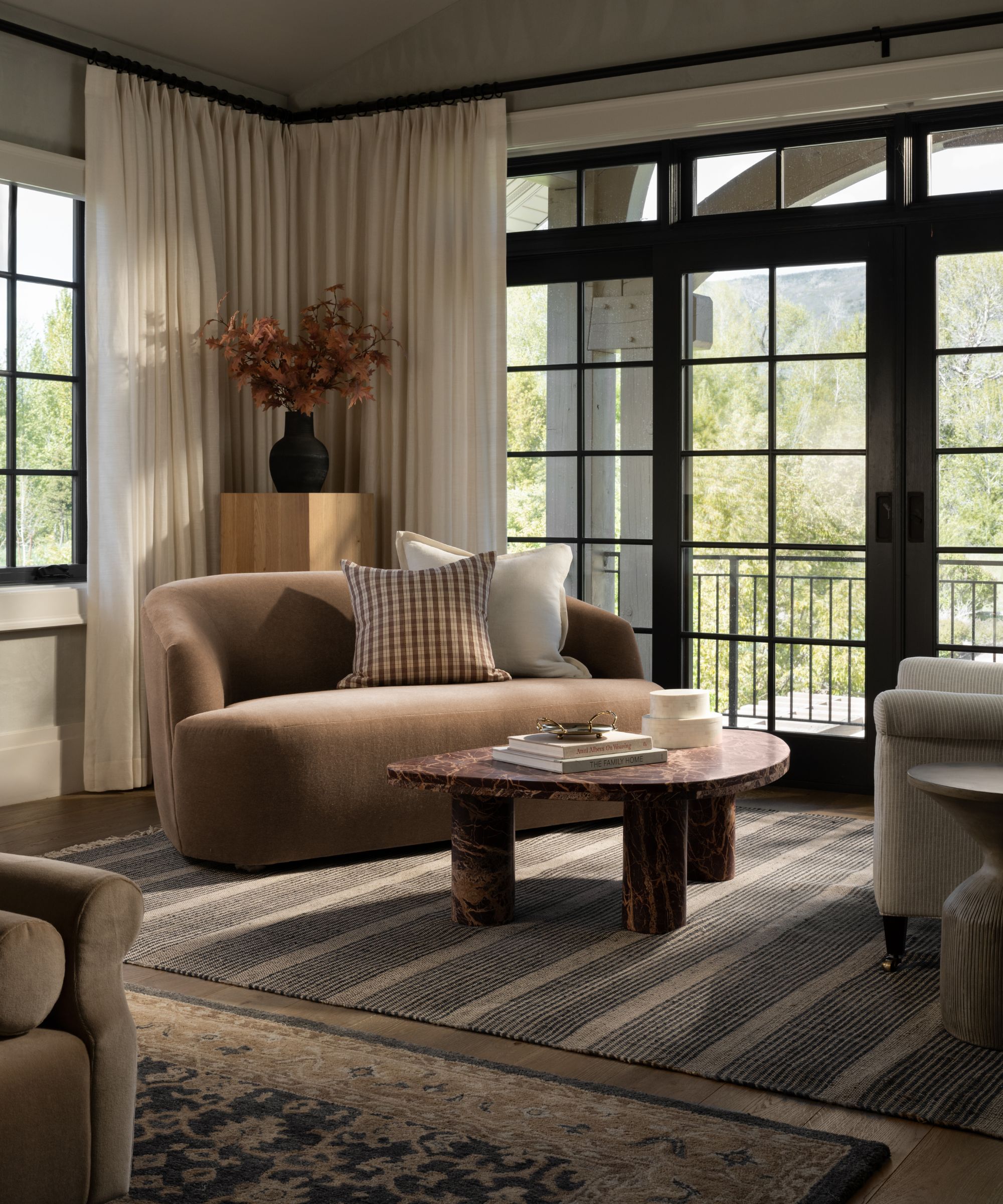 How do you combine two rugs in one room? Shea Mcgee has the formula