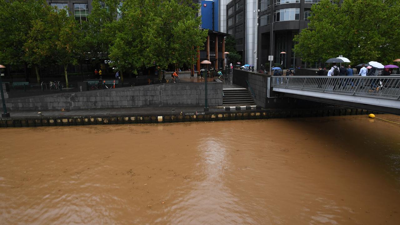 Melbourne weather Heavy rain and dust storms causes brown Yarra River