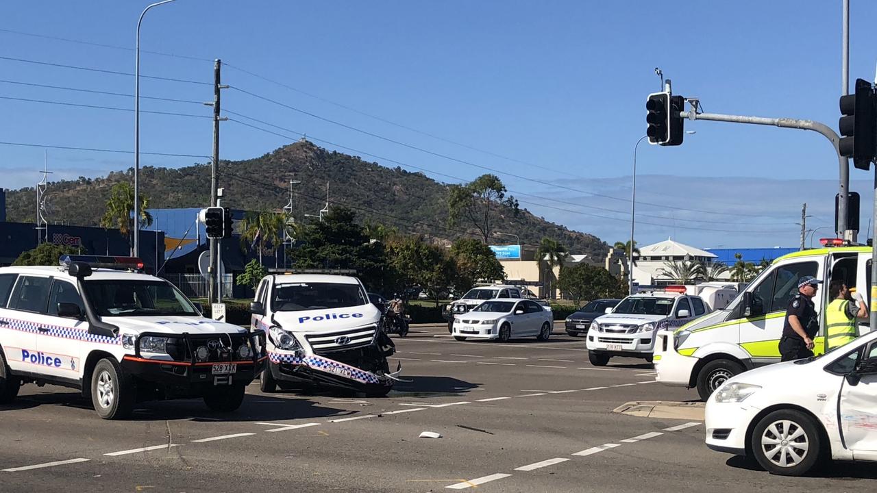 Police car crashes at Hugh St and Woolcock St intersection in
