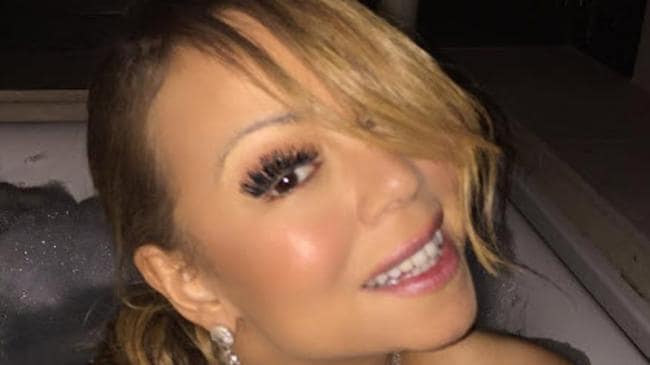 Mariah Carey poses naked in a bubble bath for Instagram fans