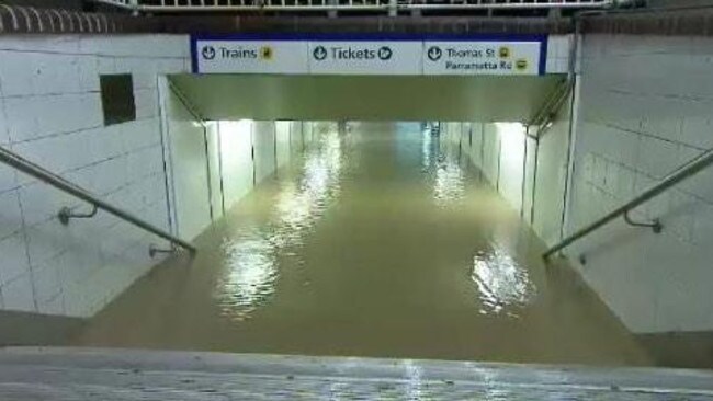 Sydney storm shuts down airport with flight delays, road closures and public transport delays