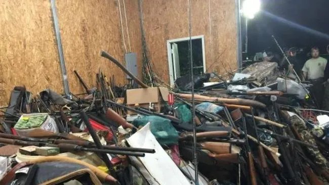 Man arrested after police find ‘menagerie’ of 10,0000 guns and ammunition