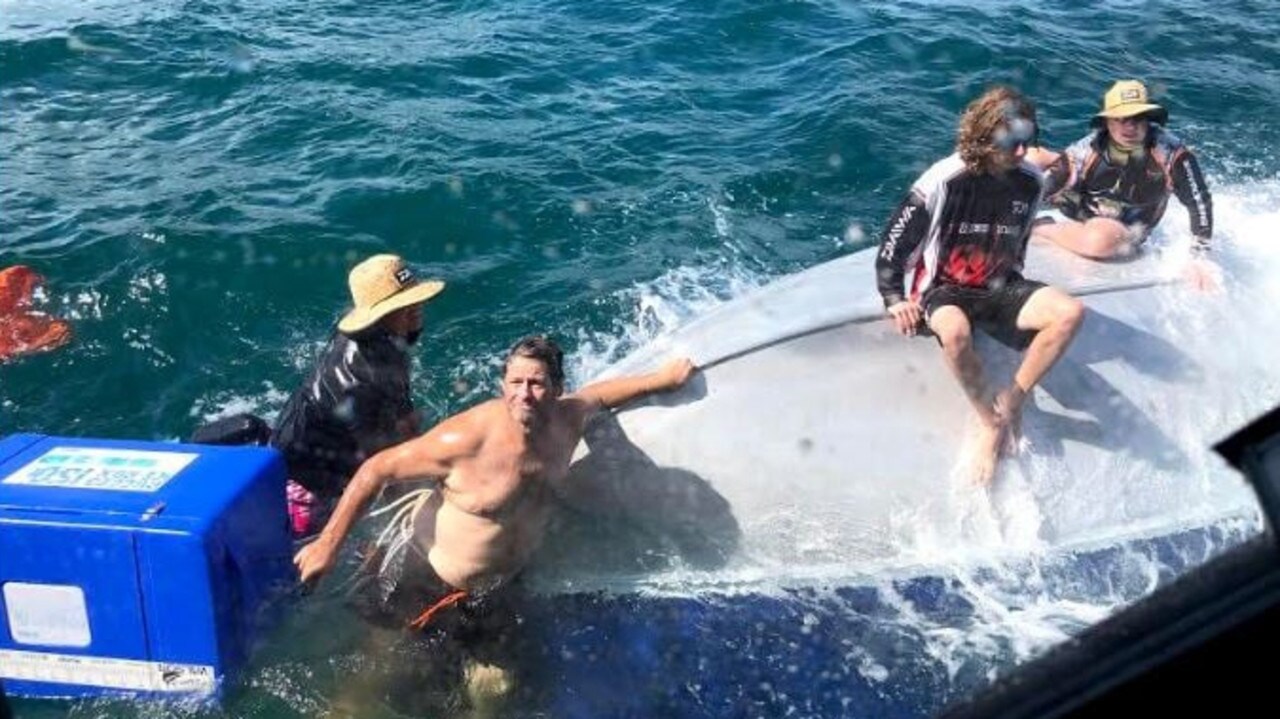 Men rescued after boat flips over during bar crossing