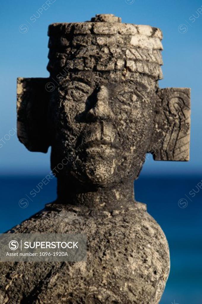 Closeup of Chac Mool statue on the beach, Cancun, Mexico SuperStock