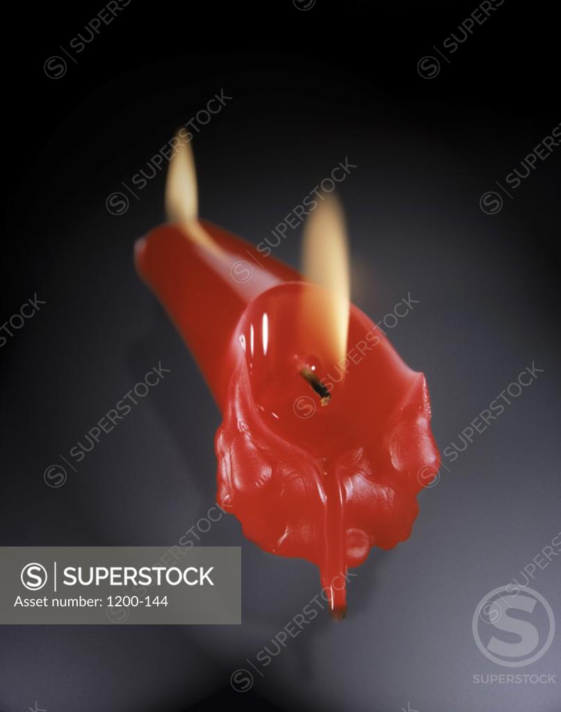 Candle burning at both ends SuperStock