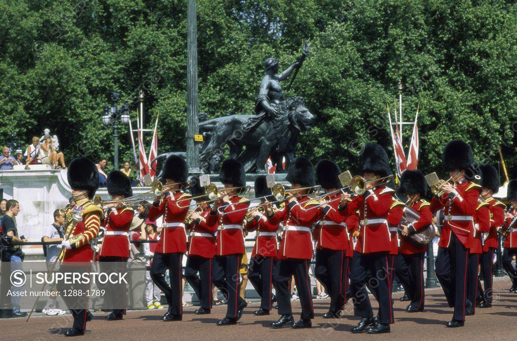 Troop of British Royal Guards marching with musical instruments