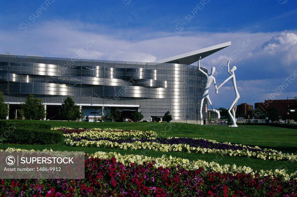 Dancing statues in front of a building, Denver Performing Arts Complex