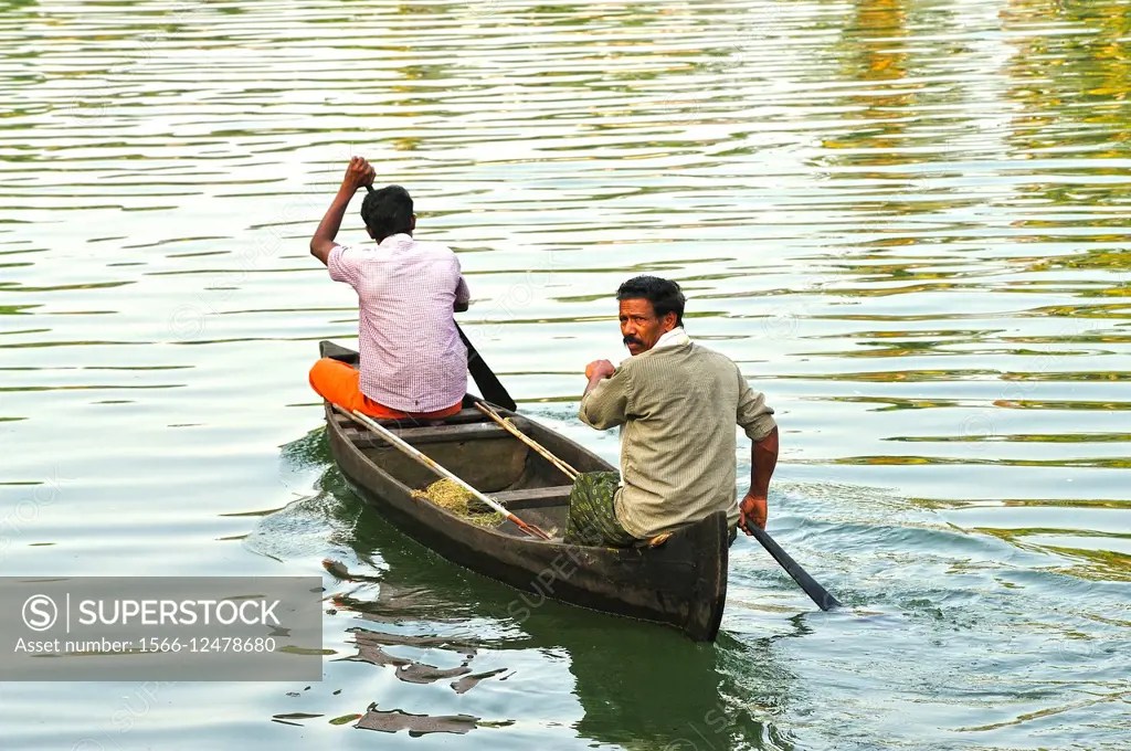 canoe in backwaters between Kollam and Cochin, Kerala, India. SuperStock