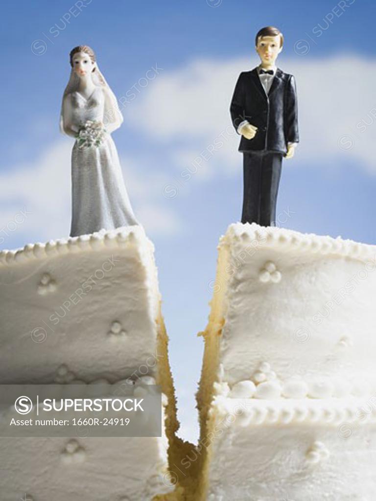 Wedding cake visual metaphor with figurine cake toppers