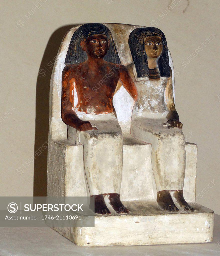 Painted limestone statue of an unnamed man and his wife from a tomb