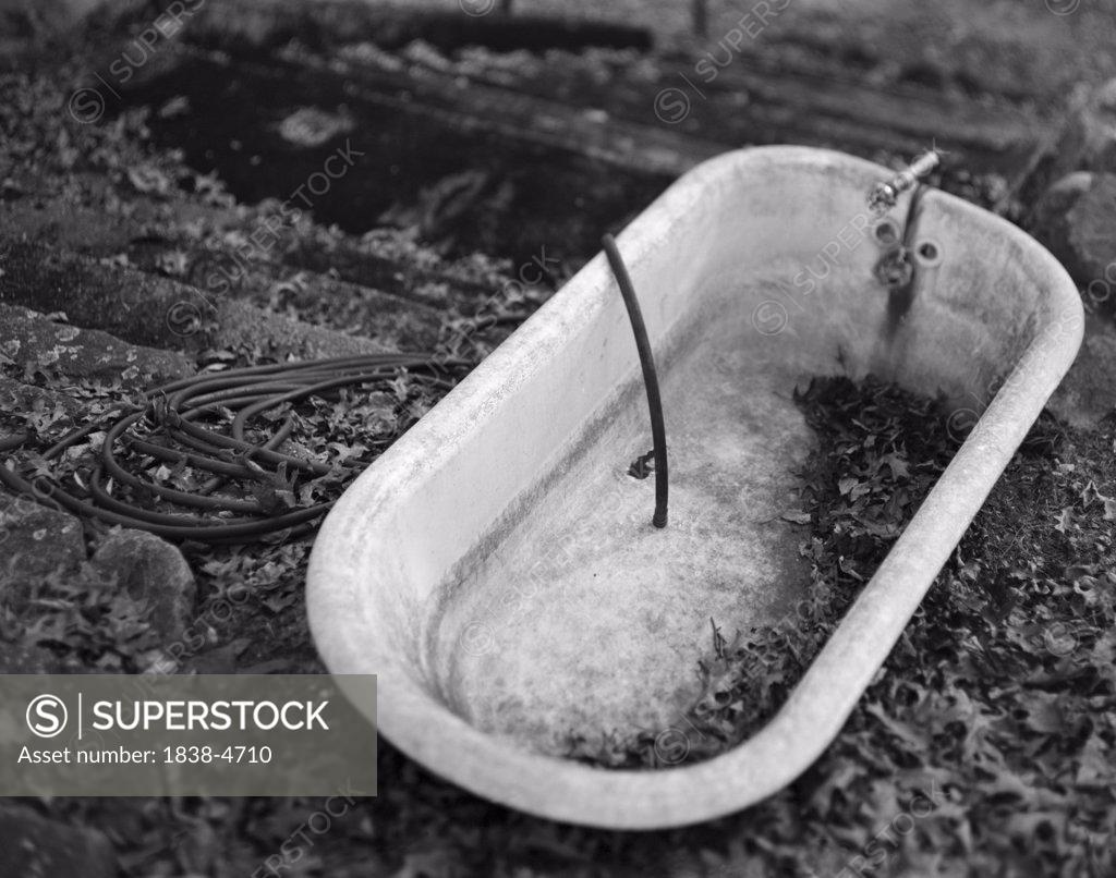 Old Dirty Bathtub Outside SuperStock