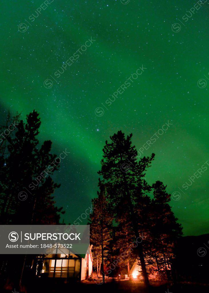 Illuminated wall tent, cabin, green northern polar lights, Aurora