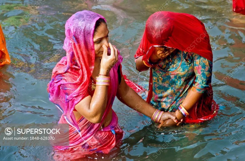 Two women taking bath at HarKiPauriGhat, the famous bathing ghat in