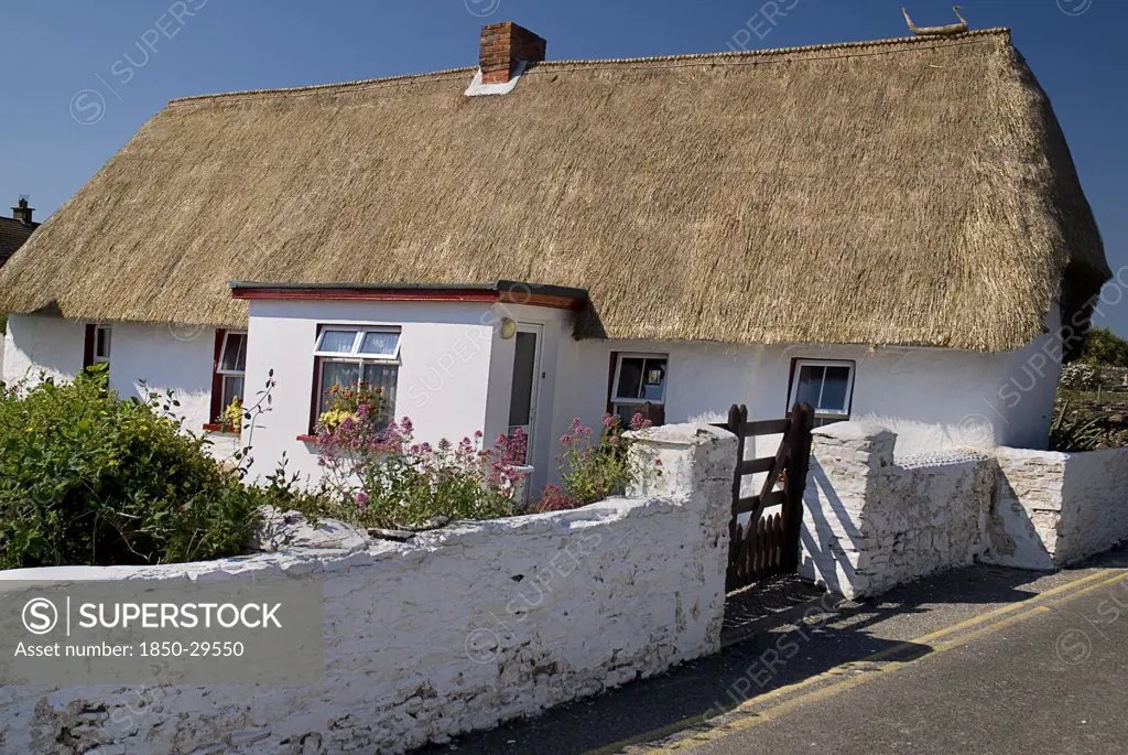 Ireland, County Wexford, Kilmore Quay, Thatched Cottage In Fishing Village Renowned For Such