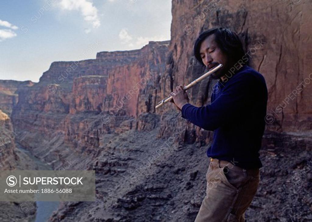 Man plays flute above LEDGES CAMP (mile 151) GRAND CANYON NATIONAL