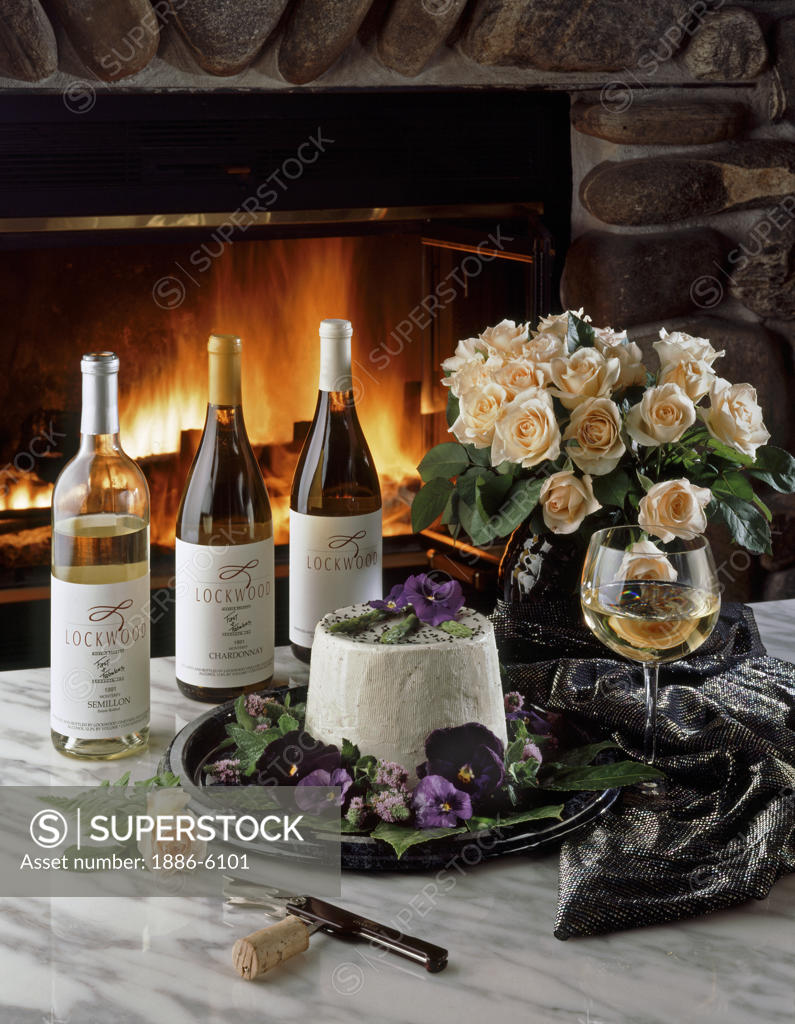LOCKWOOD VINEYARD WINES with CHEESE and ROSES backlit by warm FIREPLACE