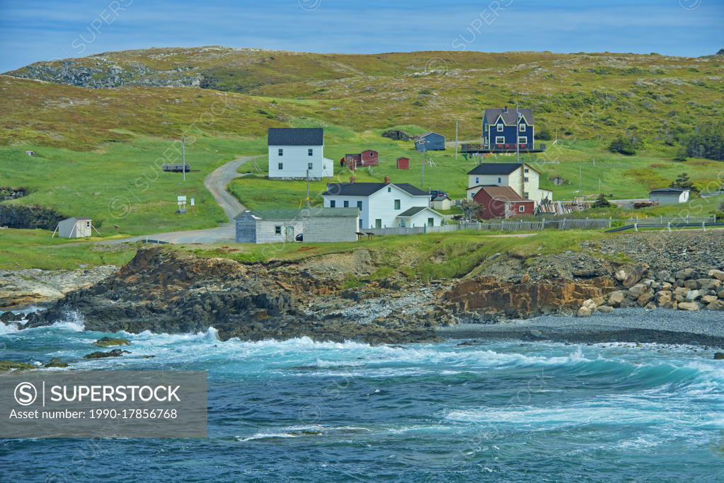 Rocky shoreline, houses and the Atlantic Ocean on the Bonavista Peninsula, Elliston