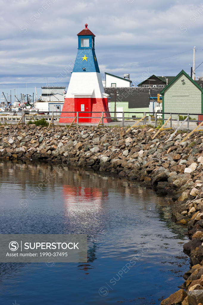 Acadian lighthouse on boardwalk along the Cheticamp waterfront, Cape