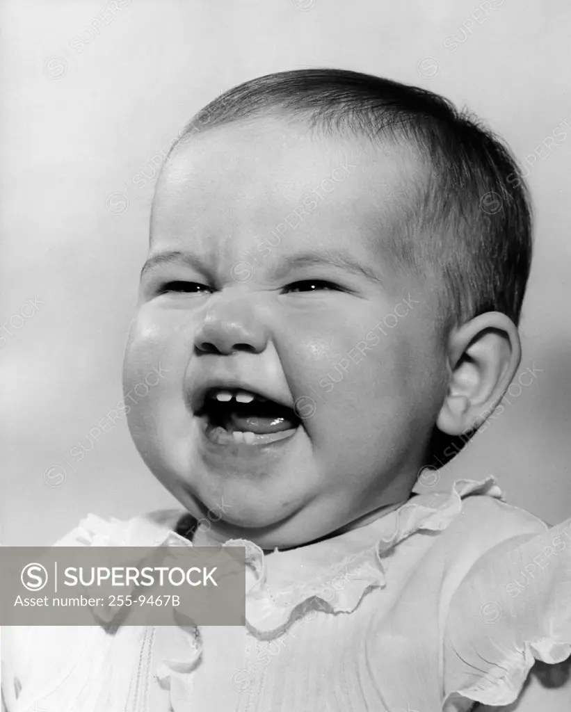 Baby girl crying SuperStock