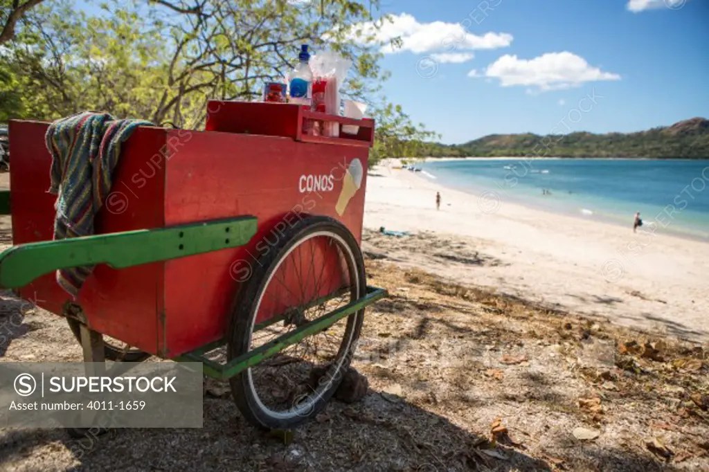 Costa Rica, Ice cream cart in shade on beach SuperStock