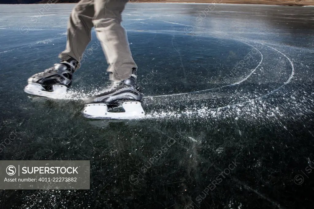 USA, Colorado, Ice skating at Blue Mesa Reservoir SuperStock