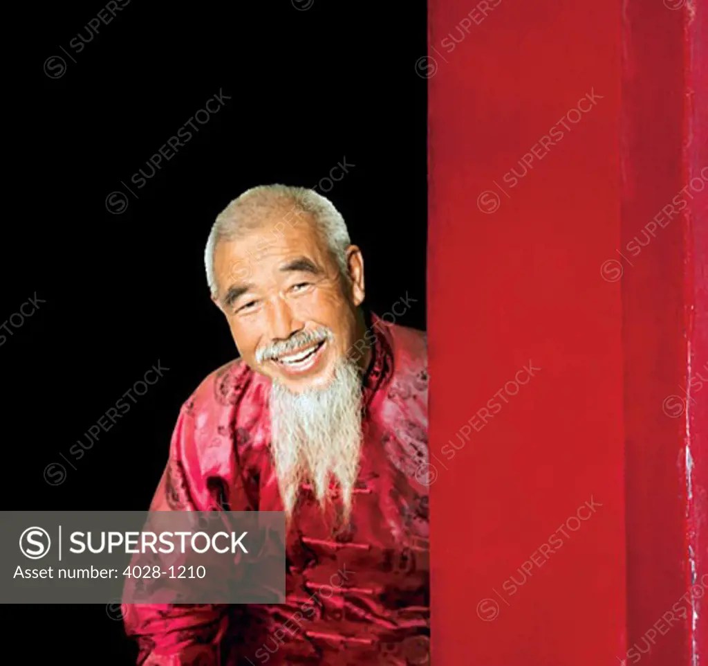 China, Beijing, An old Chinese man dressed in traditional clothes with