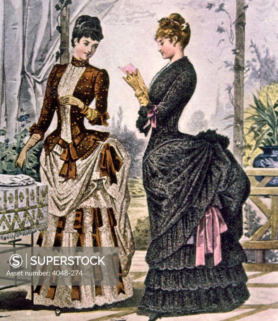 Two women wearing bustle dresses, circa 1880s. Photo Courtesy Everett