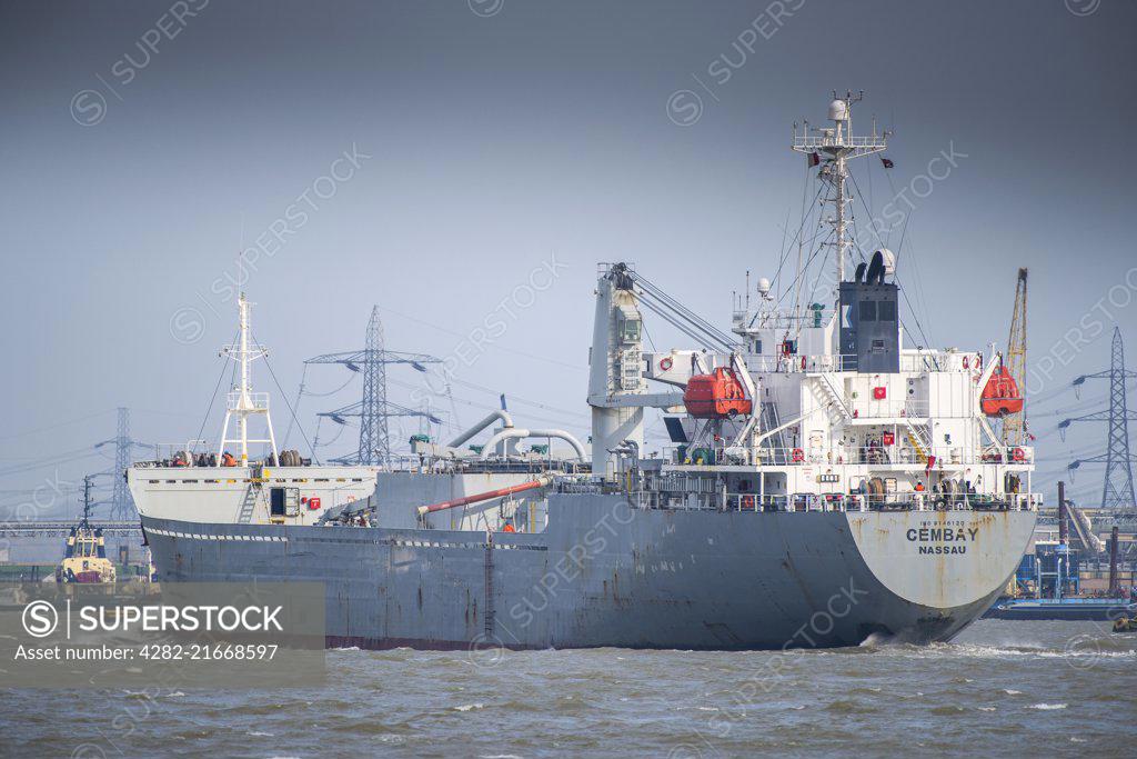 The cement carrier Cembay steams downriver on the River Thames