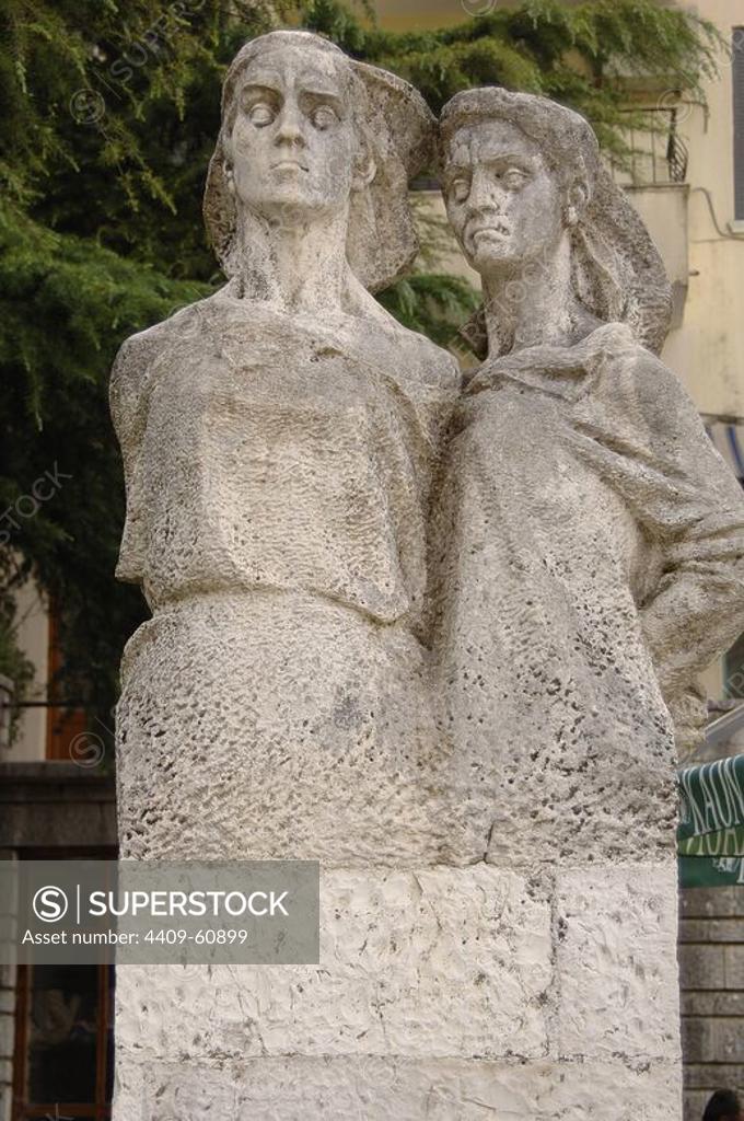 Anonymous. Hanged Woman. White stone statue of two women hanged by the