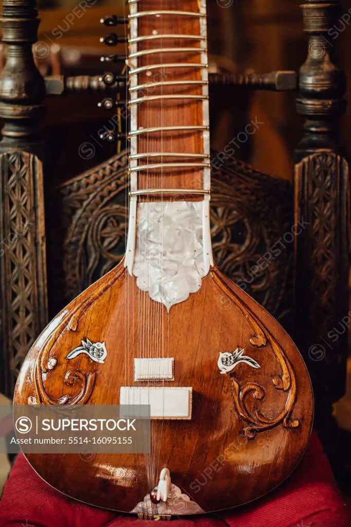 Close up photo of a sitar, traditional Indian musical instrument SuperStock