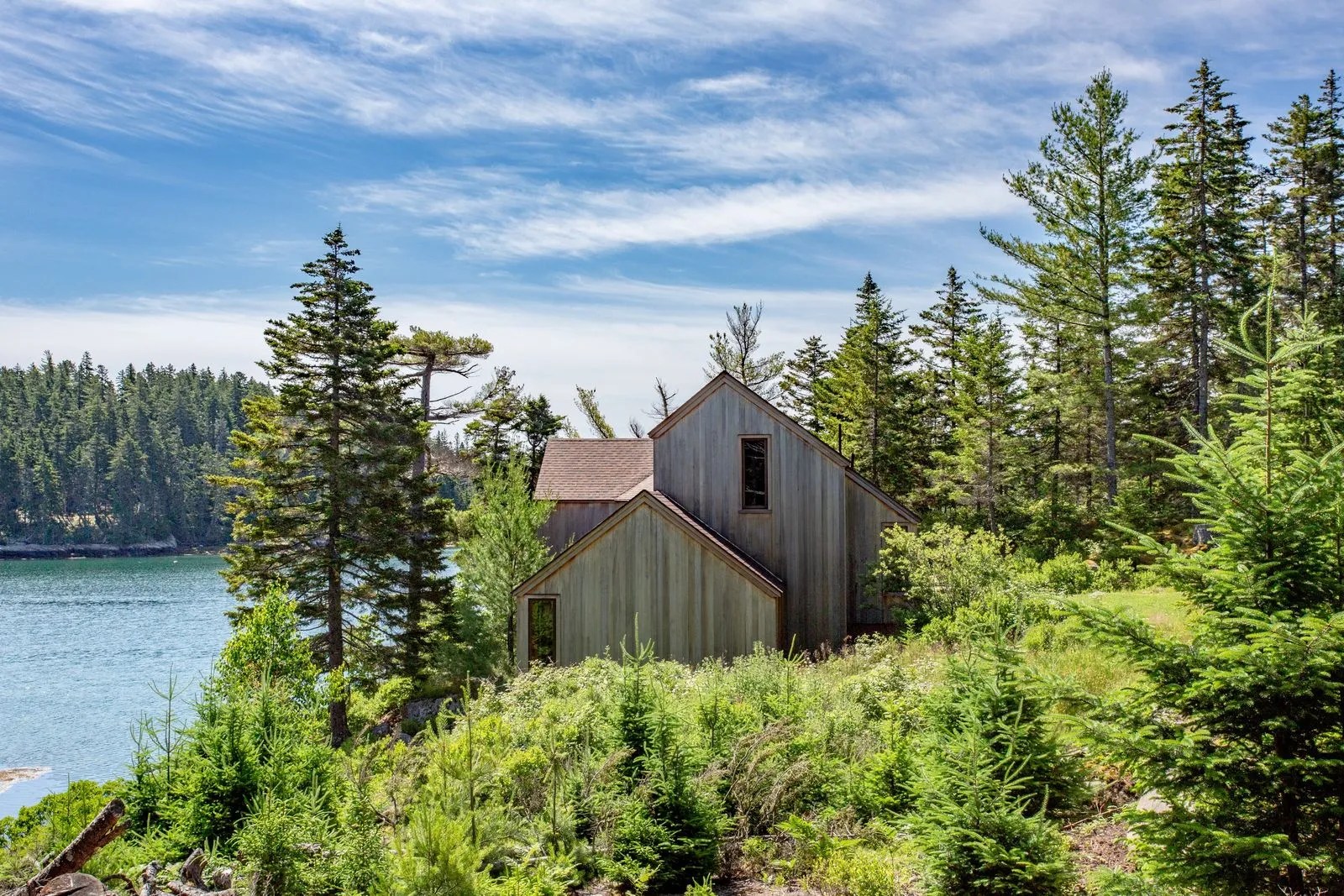 This allseason oceanfront home began life as a midcentury cabin