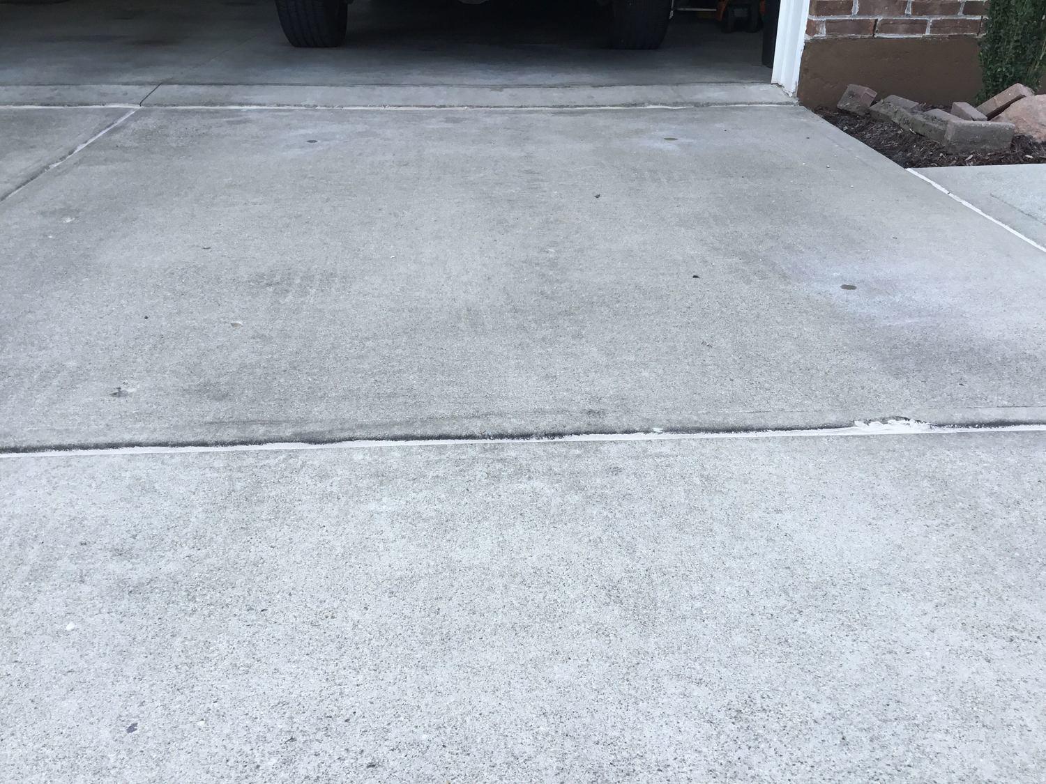 Concrete Lifting and Leveling PolyLevel used to raise a driveway slab